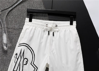 M*NCLR Embroidered Patched Logo Swim Shorts